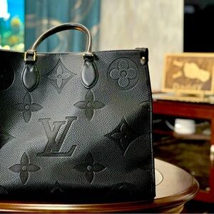 LV woman’s hand/ shoulder bag